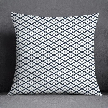 Square throw pillow with bold black and white diamond grid pattern featuring a modern geometric floral design for living room use