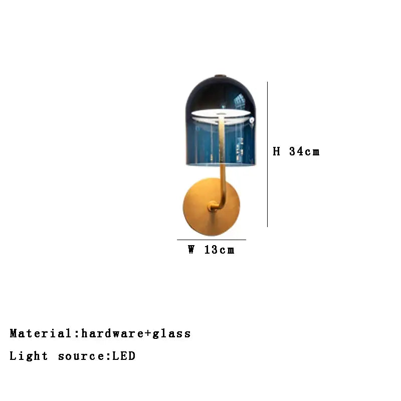 Modern blue glass dome wall sconce lamp with gold metal base featuring sleek translucent design for bedroom lighting