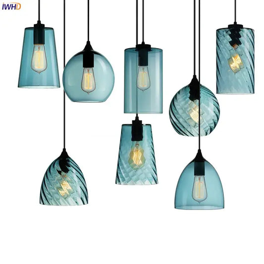 Set of seven modern blue glass led pendant lamps with textured patterns housing vintage-style bulbs for dining room lighting