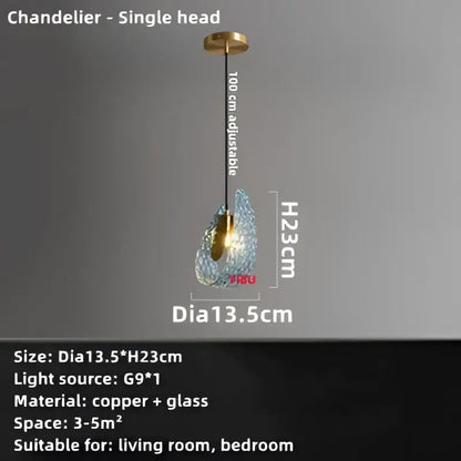 A modern single-head blue glass led pendant lamp with teardrop shade and copper hardware for dining room decorbites