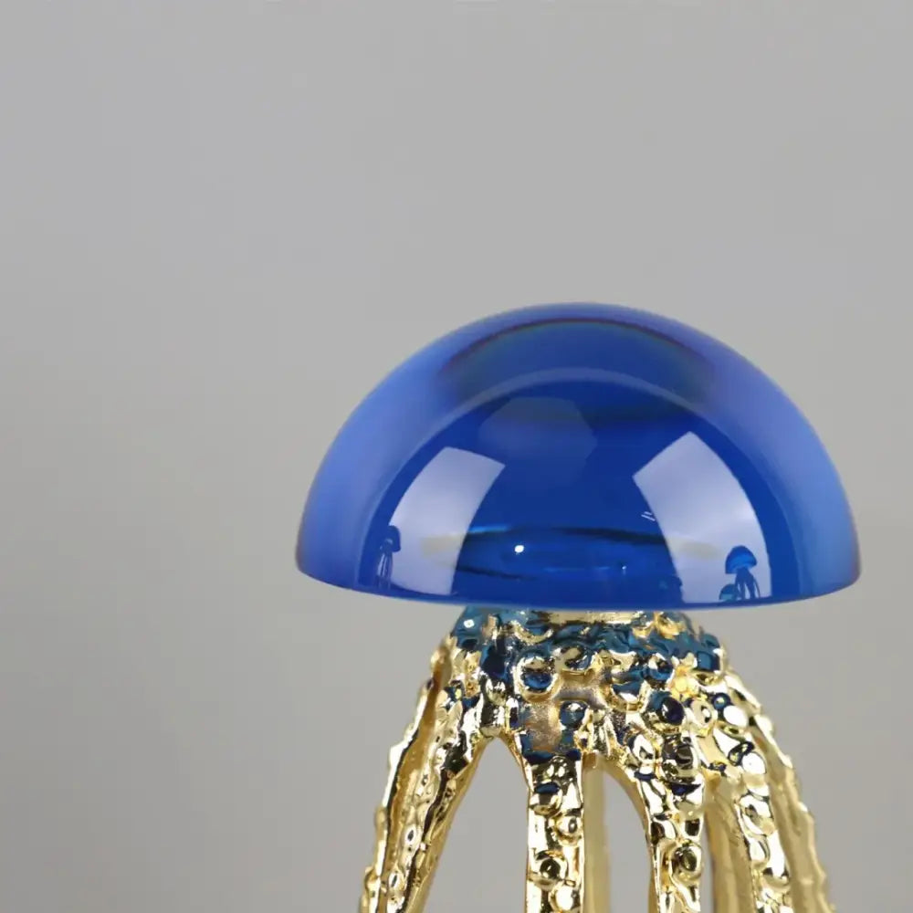 Modern blue and green crystal jellyfish sculpture with translucent blue glass and gold-toned tentacles by decorbites crystal jellyfish decor