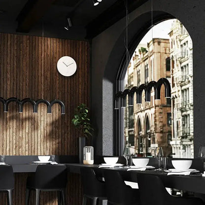 Black arched pendant lights of decorbites blue metal arch chandelier hanging above a dining table for modern kitchen decor