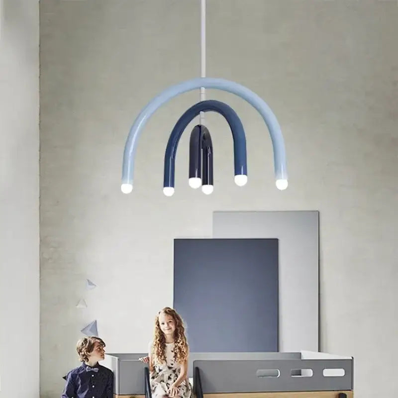 Modern blue and navy arched pendant light with layered curved arms and glowing bulbs for dining room design