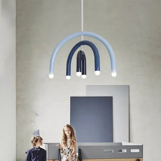 Modern blue and navy arched pendant light with layered curved arms and glowing bulbs for dining room design