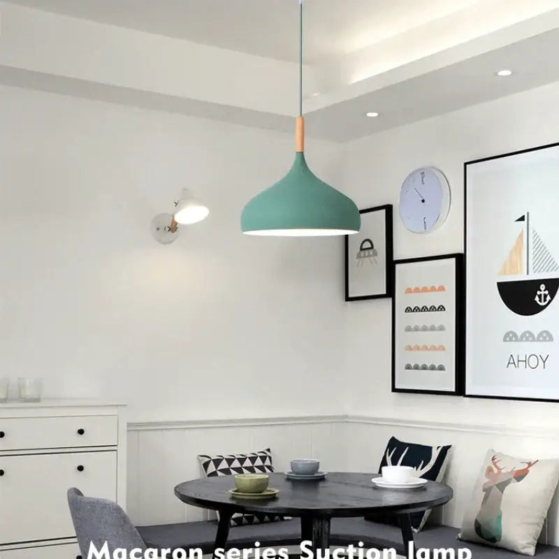 Teal pendant light with wood accent at the top helps create a modern look for kitchen lighting