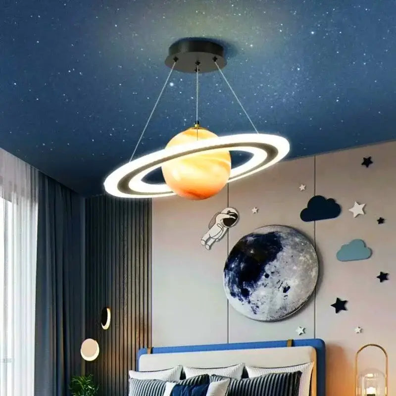 Modern blue planet pendant light featuring a glowing orange decorbites acrylic planet with bright white rings for bedroom decor