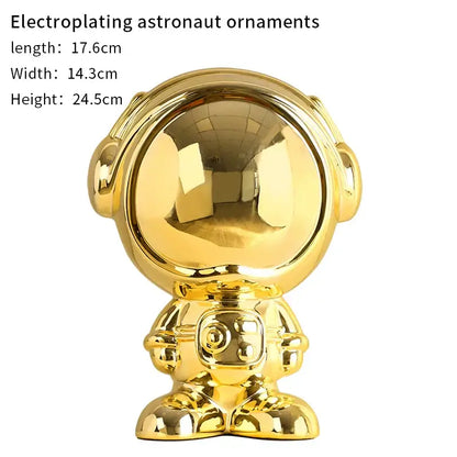 Shiny gold electroplated decorbites astronaut statue with reflective helmet and detailed suit for living room decor