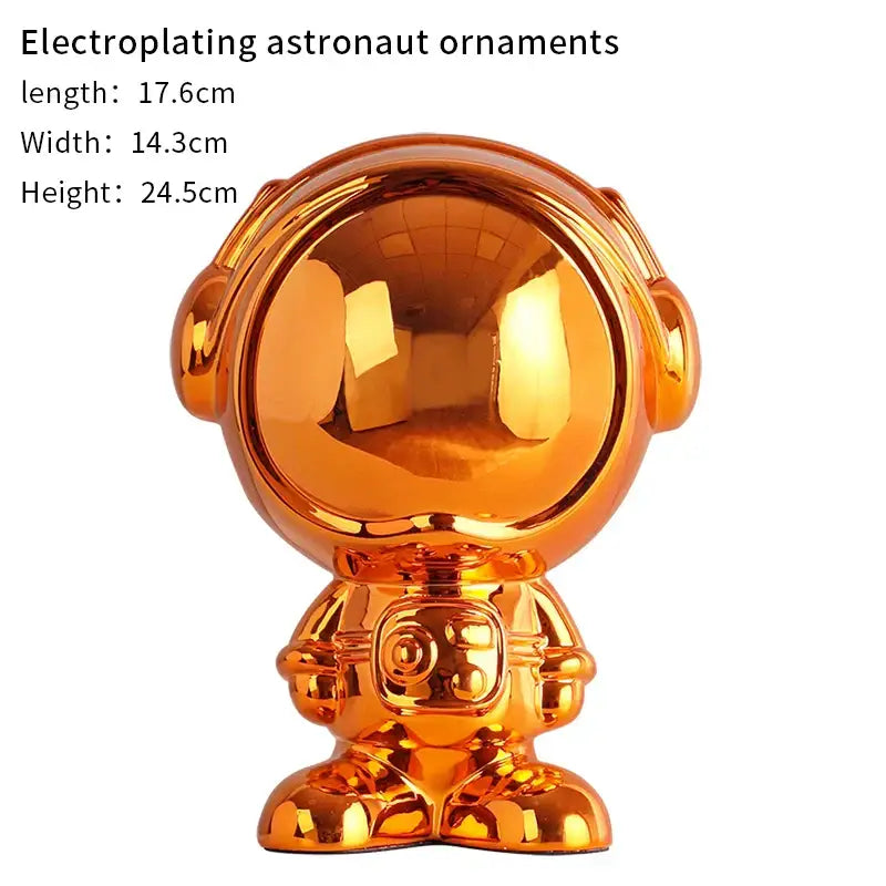Shiny gold electroplated decorbites astronaut statue with reflective helmet and detailed suit for living room decor