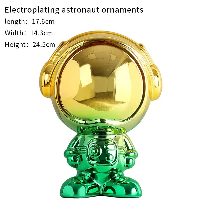 Modern blue and red gradient decorbites astronaut statue featuring shiny gold and green electroplated suit and reflective helmet