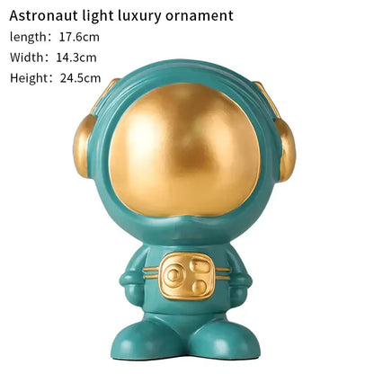 Teal and gold glossy astronaut statue with rounded helmet and metallic accents for modern living room decorbites astronaut statue