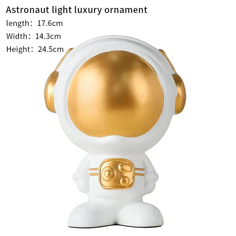 White and gold glossy decorbites astronaut statue with golden visor and chest panel for living room decor
