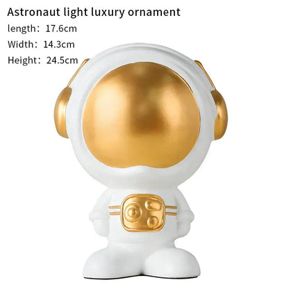 White and gold glossy decorbites astronaut statue with golden visor and chest panel for living room decor