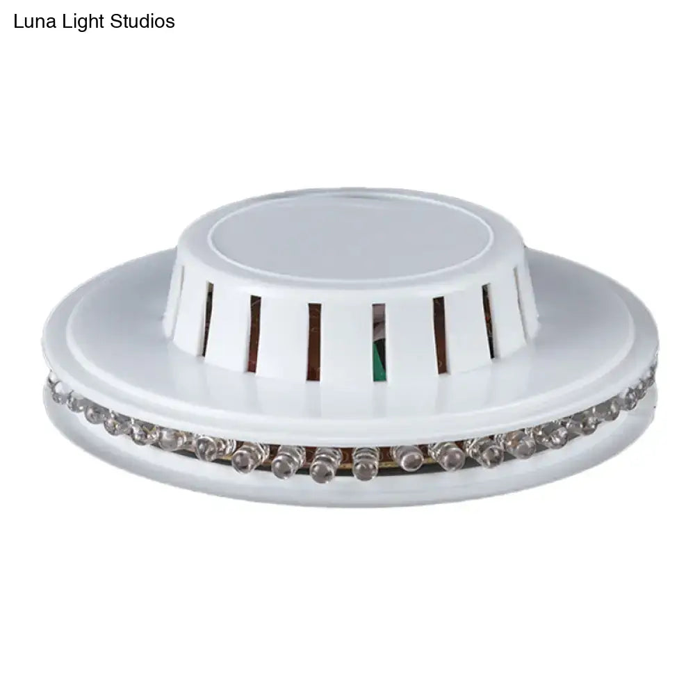 Modern blue ufo karaoke bar wall light featuring a white circular LED ceiling fixture with ventilation slits and sleek design