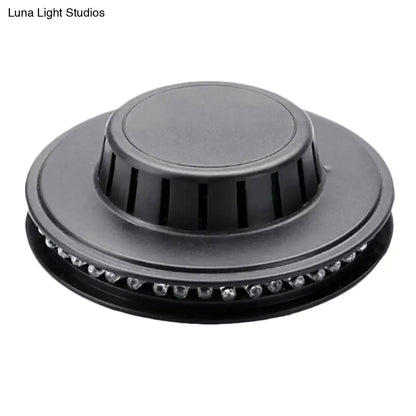 Black circular led ufo karaoke bar wall light with central vented cap and perimeter clear leds for bedroom use