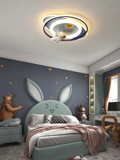Modern blue and white airplane ceiling light with a glowing moon center and decorbites astronaut spaceman figure suspended in space