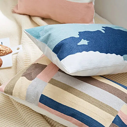 Rectangular embroidered geometric cotton cushion cover with modern abstract stripes in soft blues and earth tones for bedroom