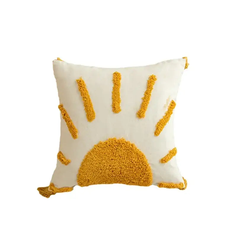 Cream-colored cushion cover with textured mustard-yellow sun design and tassel trim for modern boho decorbites geometric tufted tassel