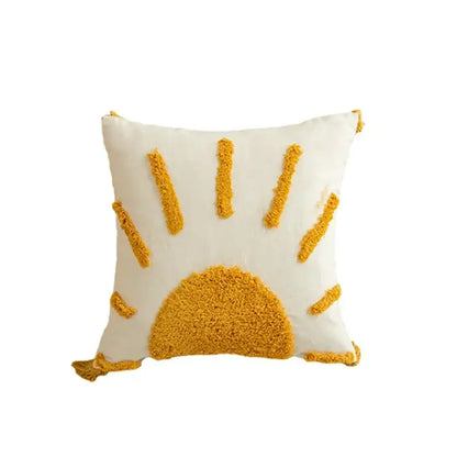 Cream-colored cushion cover with textured mustard-yellow sun design and tassel trim for modern boho decorbites geometric tufted tassel