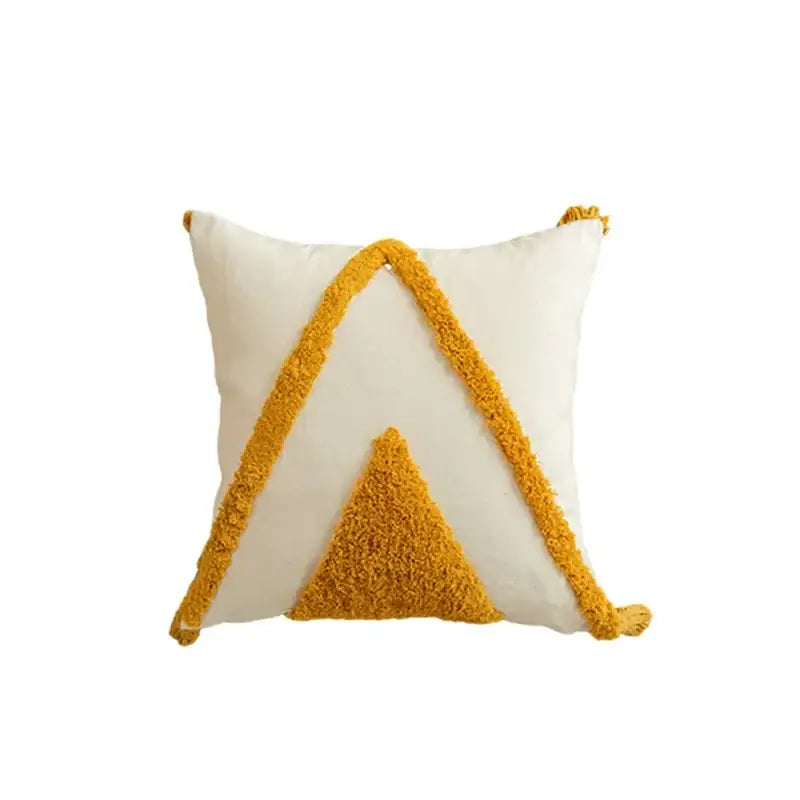 Cream-colored cushion cover with mustard yellow geometric tufted tassel design for modern boho living room decorbites