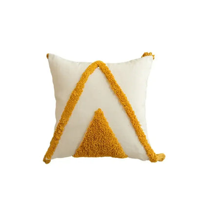 Cream-colored cushion cover with mustard yellow geometric tufted tassel design for modern boho living room decorbites