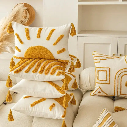 White throw cushion cover with mustard yellow embroidered sun and matching tassels decorbites geometric tufted tassel design