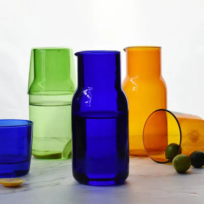 Vibrant cobalt blue borosilicate glass tea pot with sleek modern design and matching spout for kitchen use