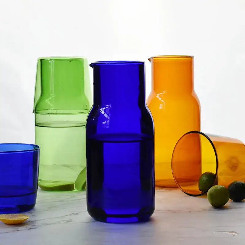 Vibrant cobalt blue borosilicate glass tea pot with sleek modern design and matching spout for kitchen use