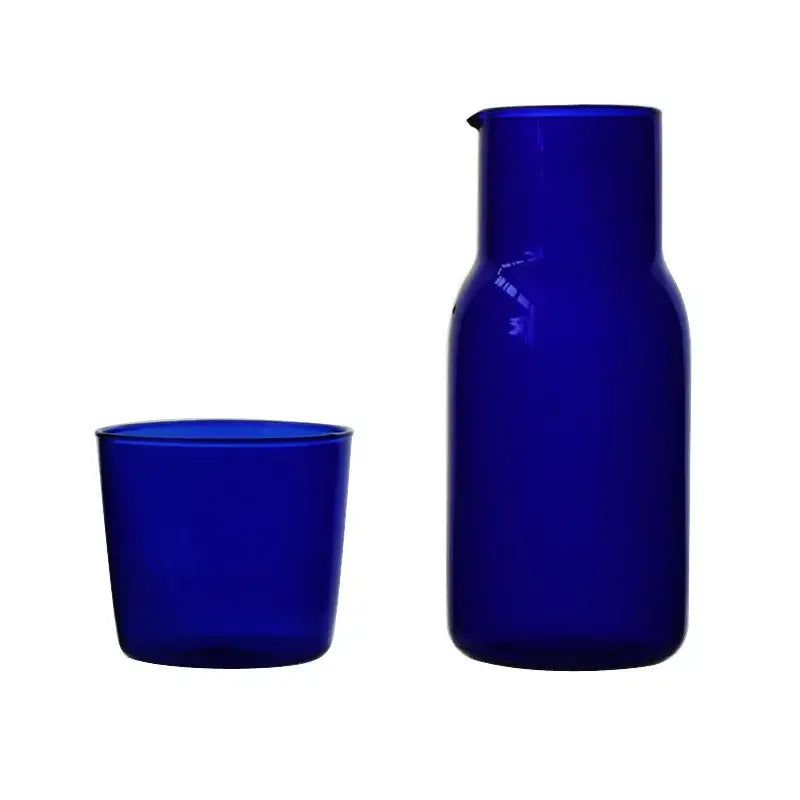 Deep cobalt blue modern borosilicate glass tea pot with spout and matching tumbler for kitchen fruit infuser pitcher