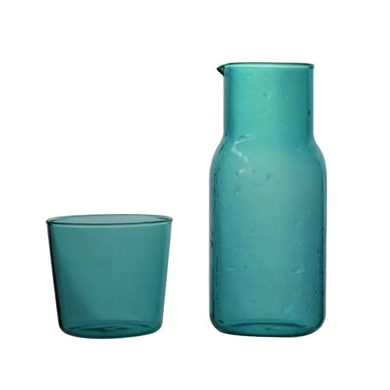 Modern teal borosilicate glass tea pot with spout and matching tumbler for kitchen fruit infuser pitcher use