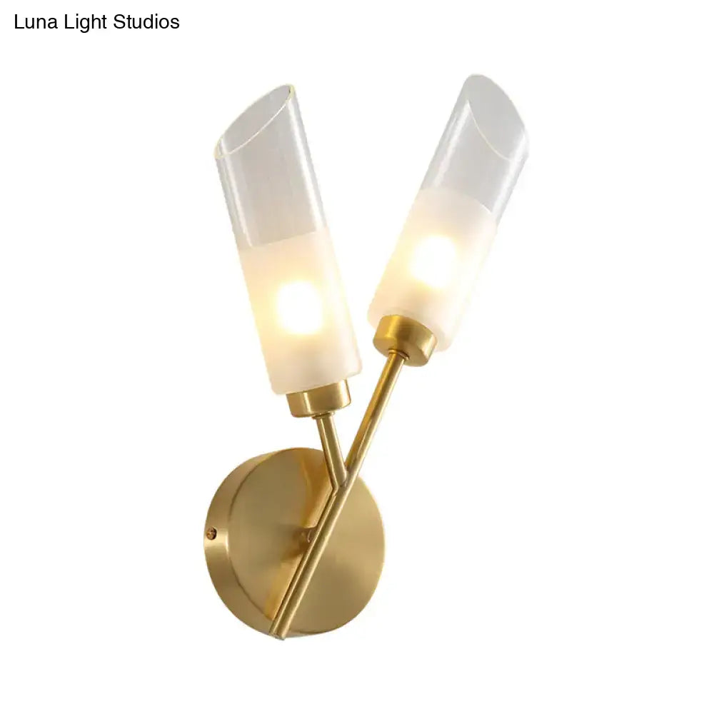 Modern brass 2-light glass wall sconce with gold-toned finish and frosted shades glowing warm for 110v-120v use