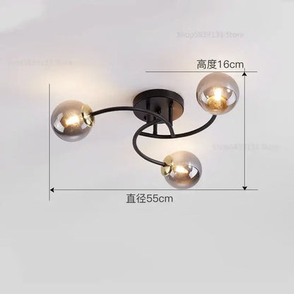 Modern black metal ceiling light fixture with three spherical glass bulb shades for kitchen ceiling lighting