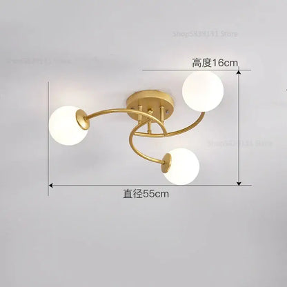 Modern brass ceiling light fixture with five frosted glass bulbs and curved metallic arms for kitchen lighting