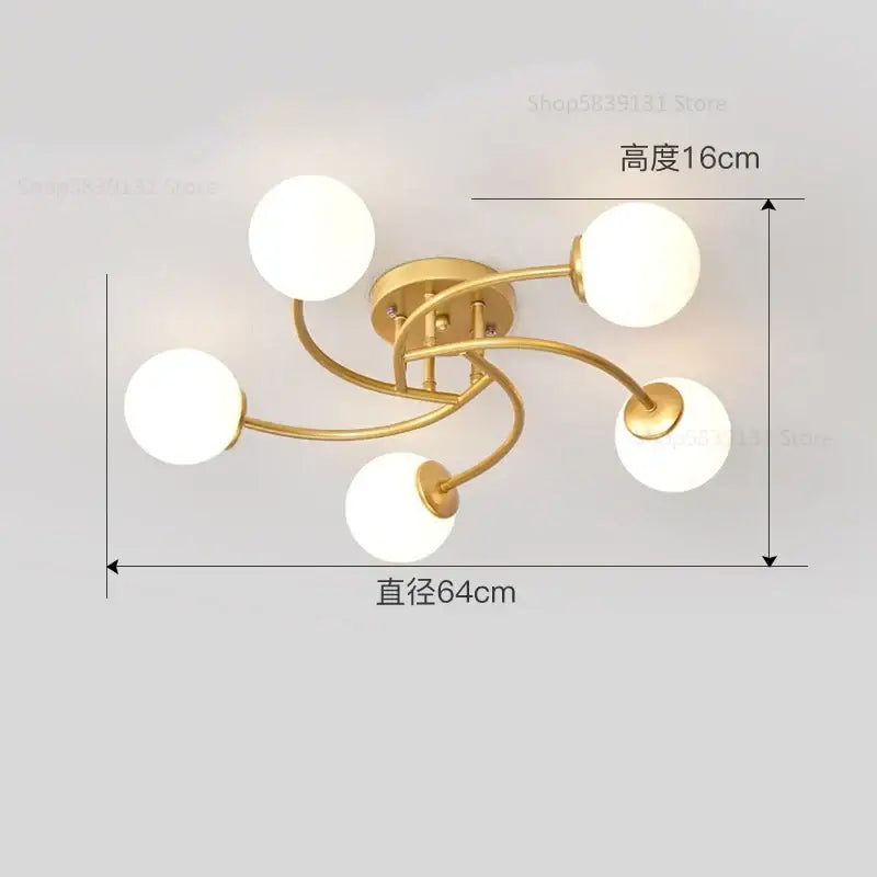 Modern brass ceiling light fixture with five white frosted glass bulb shades ideal for kitchen lighting