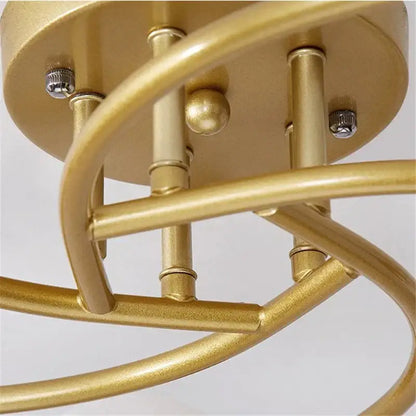 Modern brass 5-light ceiling light fixture with gold-finished metal spiral arms and frosted glass bulbs for kitchen use