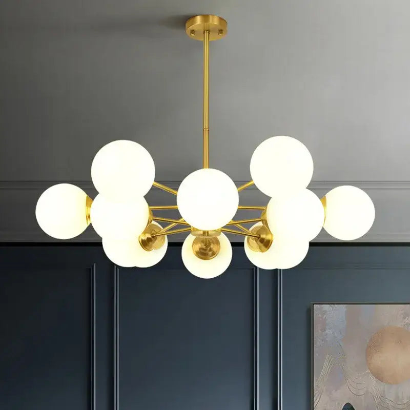 Modern brass 8-light pendant lights with gold-toned glass ball globes by decorbites for elegant dining room decor