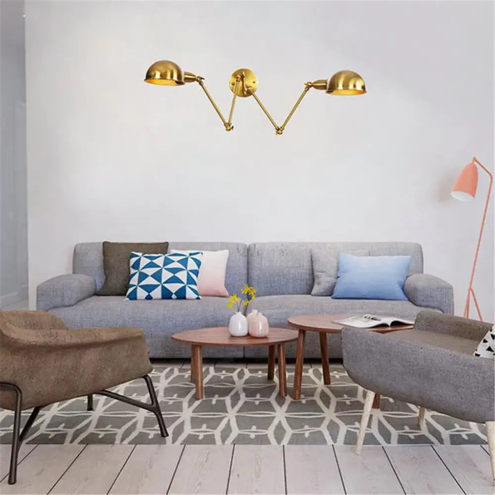Gold-colored modern brass adjustable arm wall sconces with three dome-shaped lamp heads for bedroom decorbites gold plated wall lamps