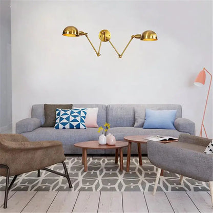 Gold-colored modern brass adjustable arm wall sconces with three dome-shaped lamp heads for bedroom decorbites gold plated wall lamps
