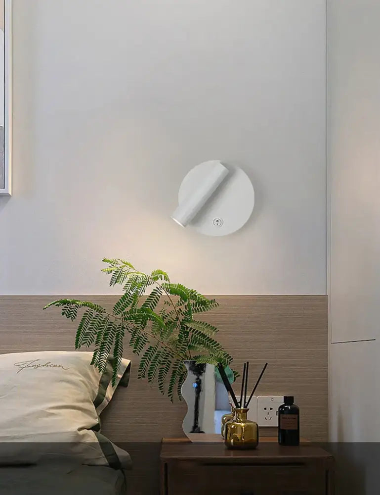 White circular wall-mounted modern brass adjustable led wall reading lamp with sleek minimalist design for bedroom decorbites adjustable led