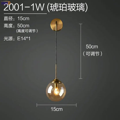 Modern brass and amber decorbites glass ball wall lamp with warm amber hue and brass-finished metal hardware for bedroom