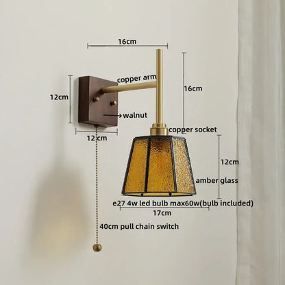 Modern brass and amber glass copper led wall lights featuring a warm amber glass lamp with copper arm on walnut plate