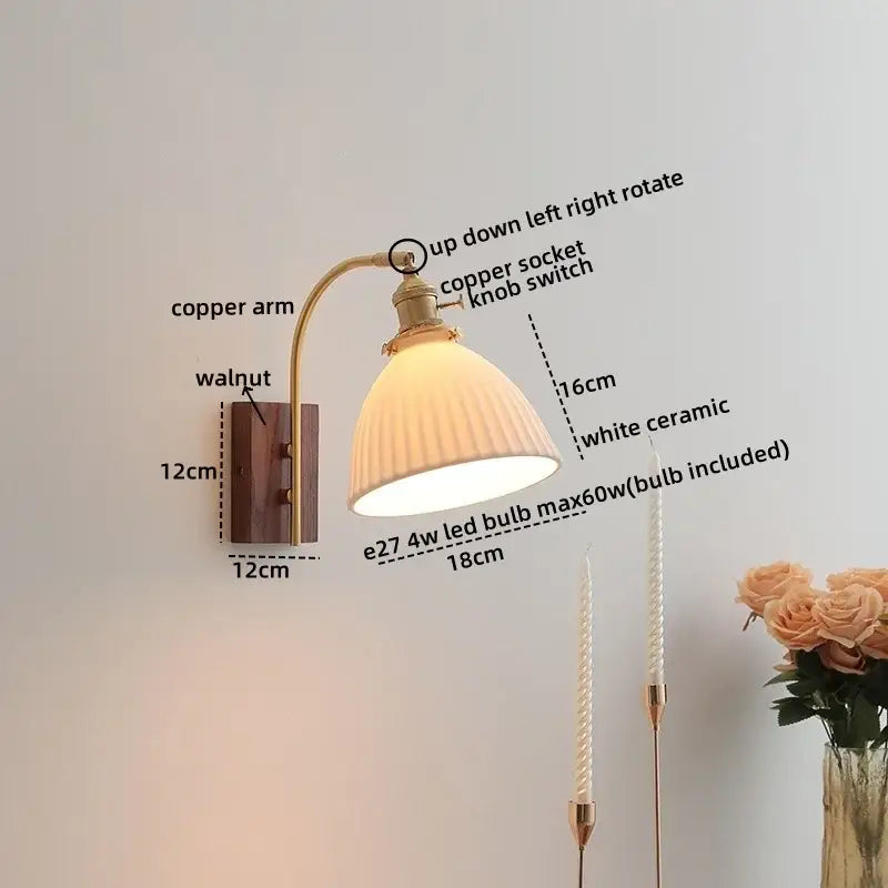 A vintage-style wall light with a curved copper led arm, walnut base, and white ceramic lampshade for bedroom use