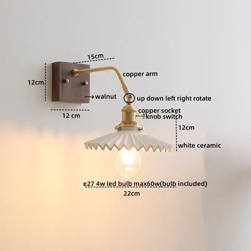 Vintage-style wall lights with brass copper led arm, walnut mount, and white ceramic scalloped shade for bedroom use
