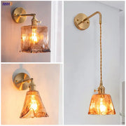 Modern brass wall lamp with decorbites amber glass shades and twisted cord design for bedroom living room decor