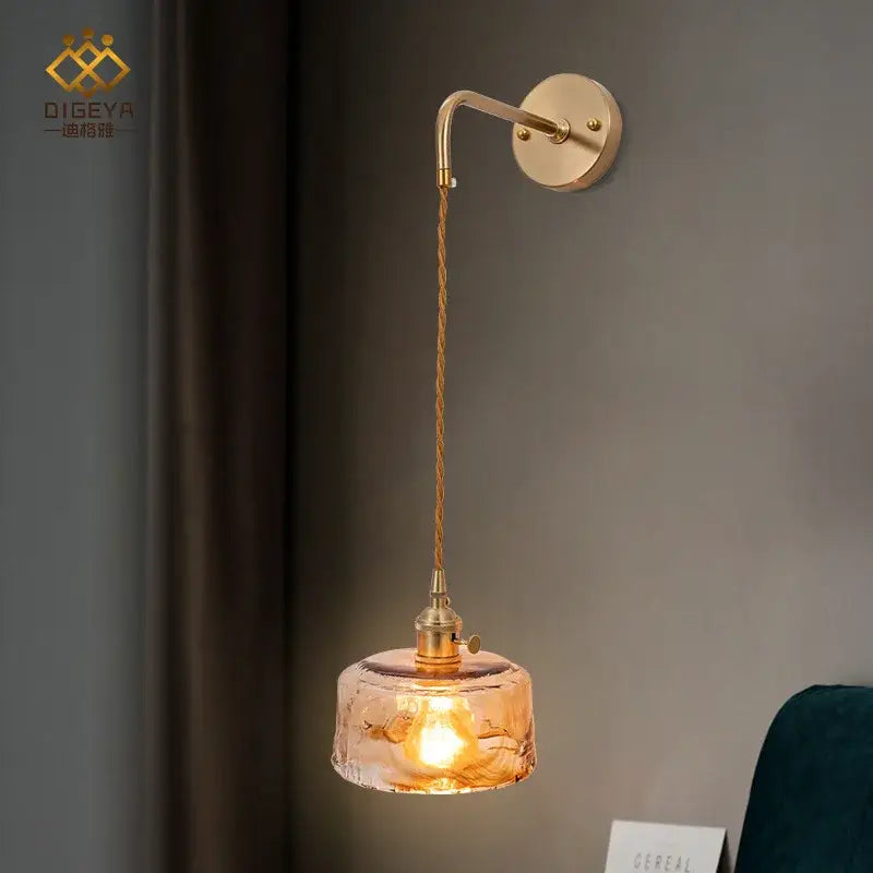Modern brass and amber glass wall lamp with textured amber glass shade and twisted cord for bedroom decorbites amber glass wall lamp