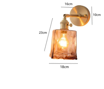 Modern brass and amber glass wall lamp with decorbites amber glass and exposed bulb for bedroom and living room decor