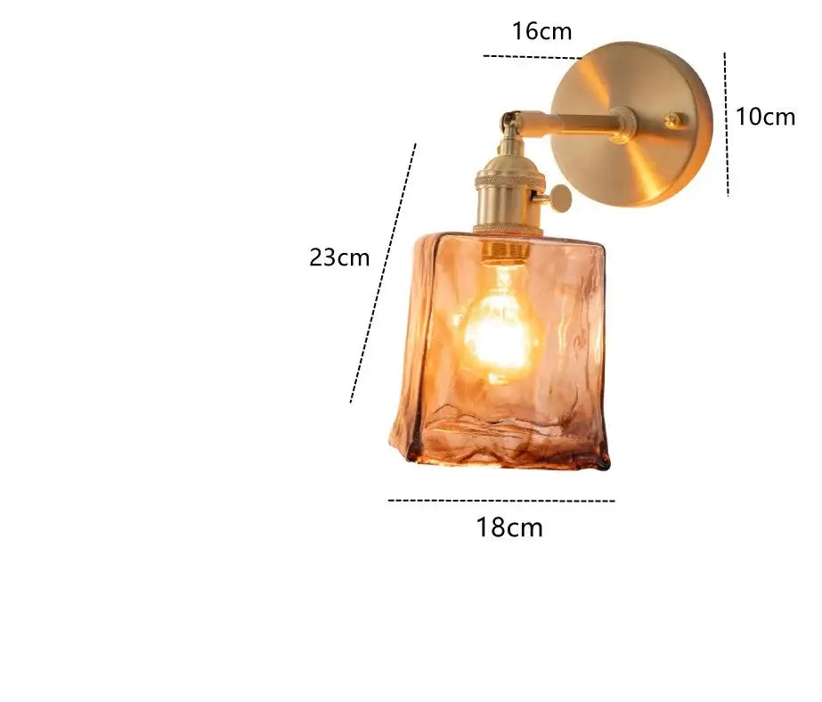 Modern brass and amber glass wall lamp with decorbites amber glass and exposed bulb for bedroom and living room decor
