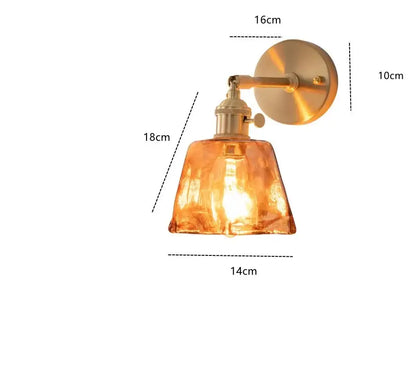Modern brass and amber glass wall lamp with warm amber glass shade and brass-finished metal arm for bedroom living room decorbites amber glass wall