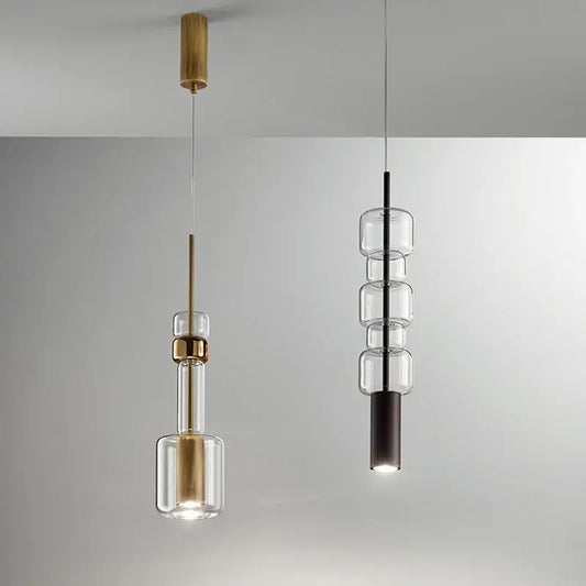 Modern brass and black cylindrical glass pendant light featuring decorbites cylindrical glass design for kitchens