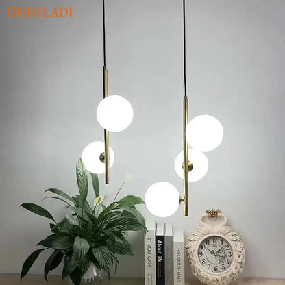 Modern brass pendant light with spherical white glass ball globes for elegant dining room decorbites glass ball design