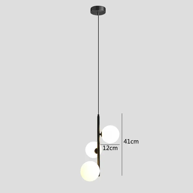 Modern brass and black glass ball pendant light with three frosted glass globe bulbs for dining room decorbites pendant light